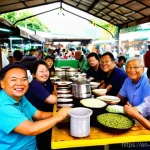 말레이시아 은퇴 비자 프로그램 - **Prompt:** A vibrant, bustling hawker center in a Malaysian city like Penang, filled with diverse p...